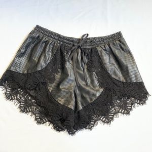 REVOLVE Black lace shorts perforated faux leather
drawstring STYLE STALKER